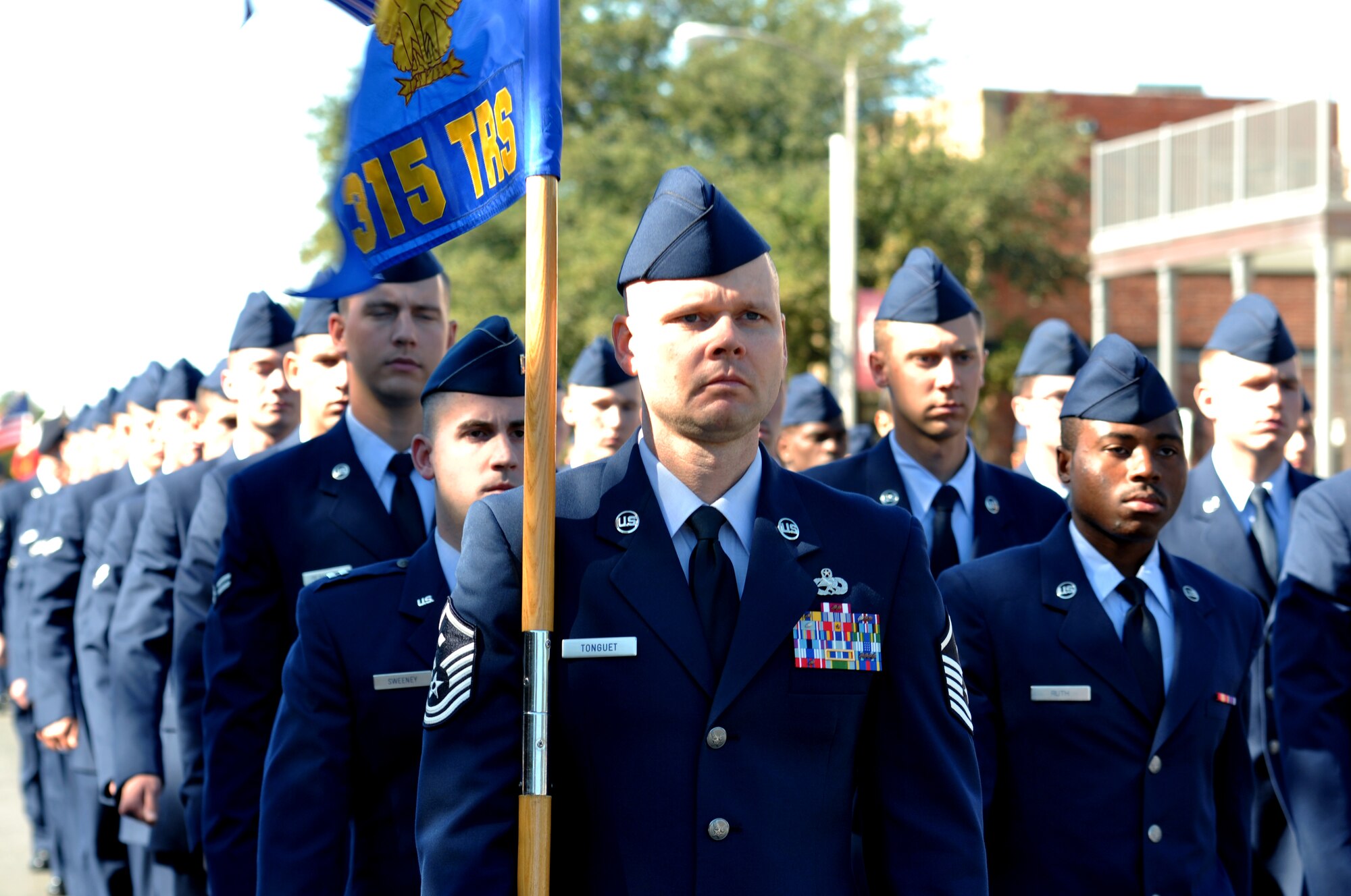 SAN ANGELO, Texas – Master Sgt. Cecil L. Tonguet Jr., 315th Training Squadron first sergeant, guides the 315th TRS formation during the Veterans Day parade downtown Nov. 8. The 315th TRS was just one of a dozen groups that made up the 500 service members in the parade.  (U.S. Air Force photo/ Senior Airman Joshua Edwards)