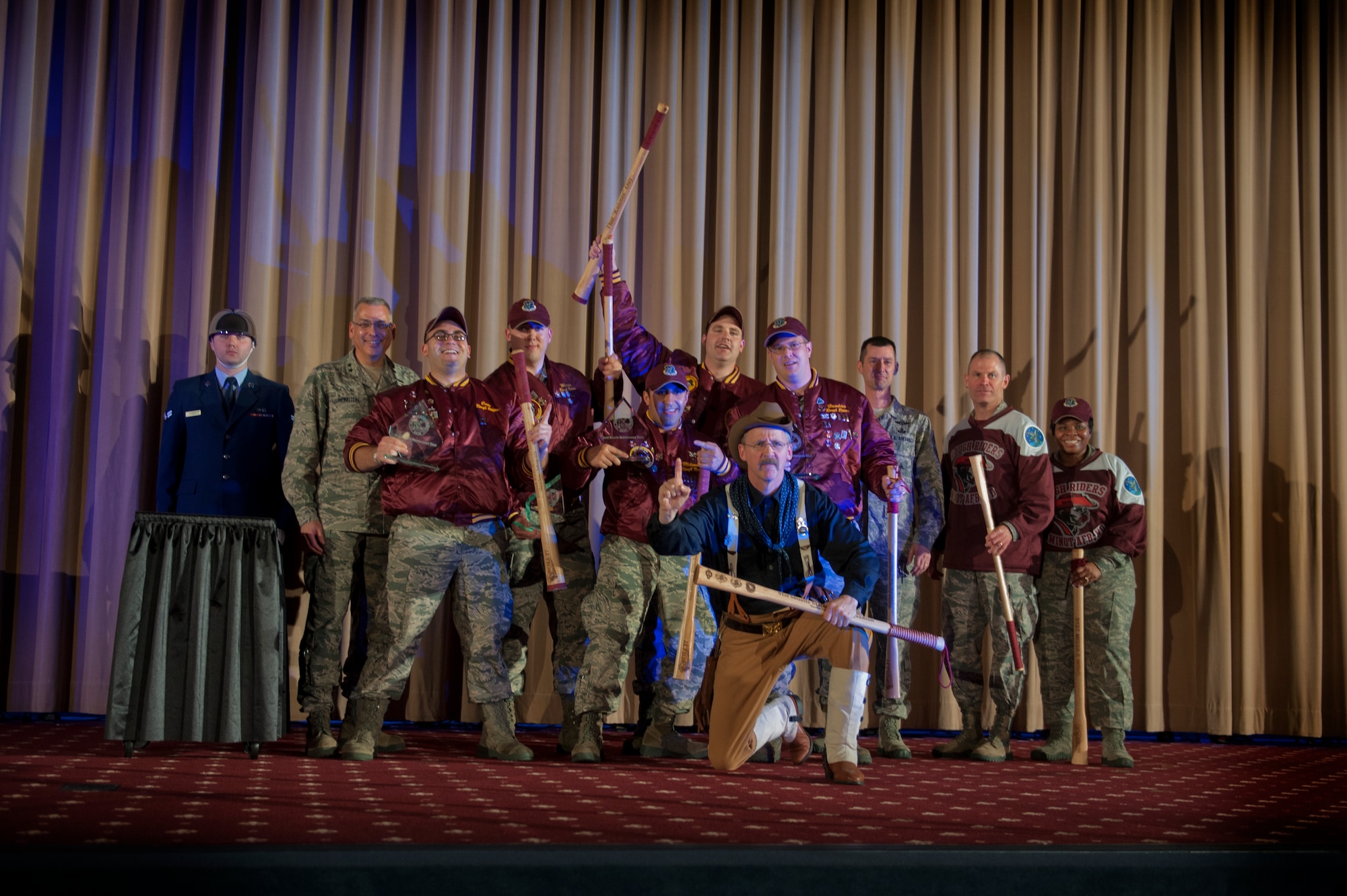 The 91st Missile Wing celebrates after winning best intercontinental ballistic missile electronics laboratory crew, during the Global Strike Challenge score posting event on Barksdale Air Force Base, La., Nov. 5, 2014. The score posting event connects the command's heritage and mission, while at the same time recognizing and celebrating the "best of the best" in technical and weapons system expertise in the bomber, missile and security forces areas. (U.S. Air force photo/Senior Airman Brittany Y. Bateman)