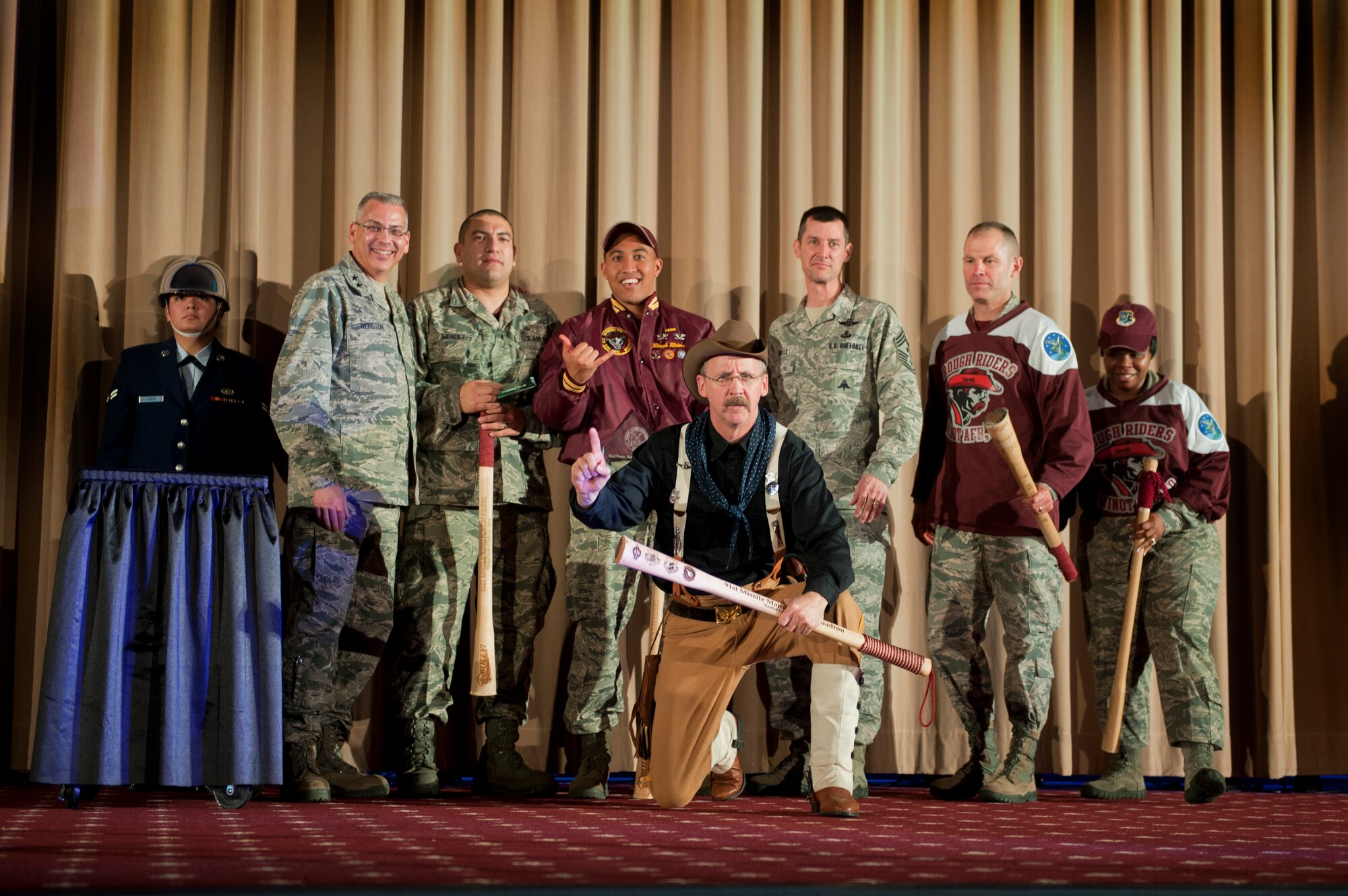 The 91st Missile Wing celebrates after winning best intercontinental ballistic missile electronics laboratory crew, during the Global Strike Challenge score posting event on Barksdale Air Force Base, La., Nov. 5, 2014. Participants in the 2014 GSC included Air Force Global Strike Command's six wings plus units from Air Combat Command, Air Force Reserve Command and the Air National Guard. (U.S. Air force photo/Senior Airman Brittany Y. Bateman)