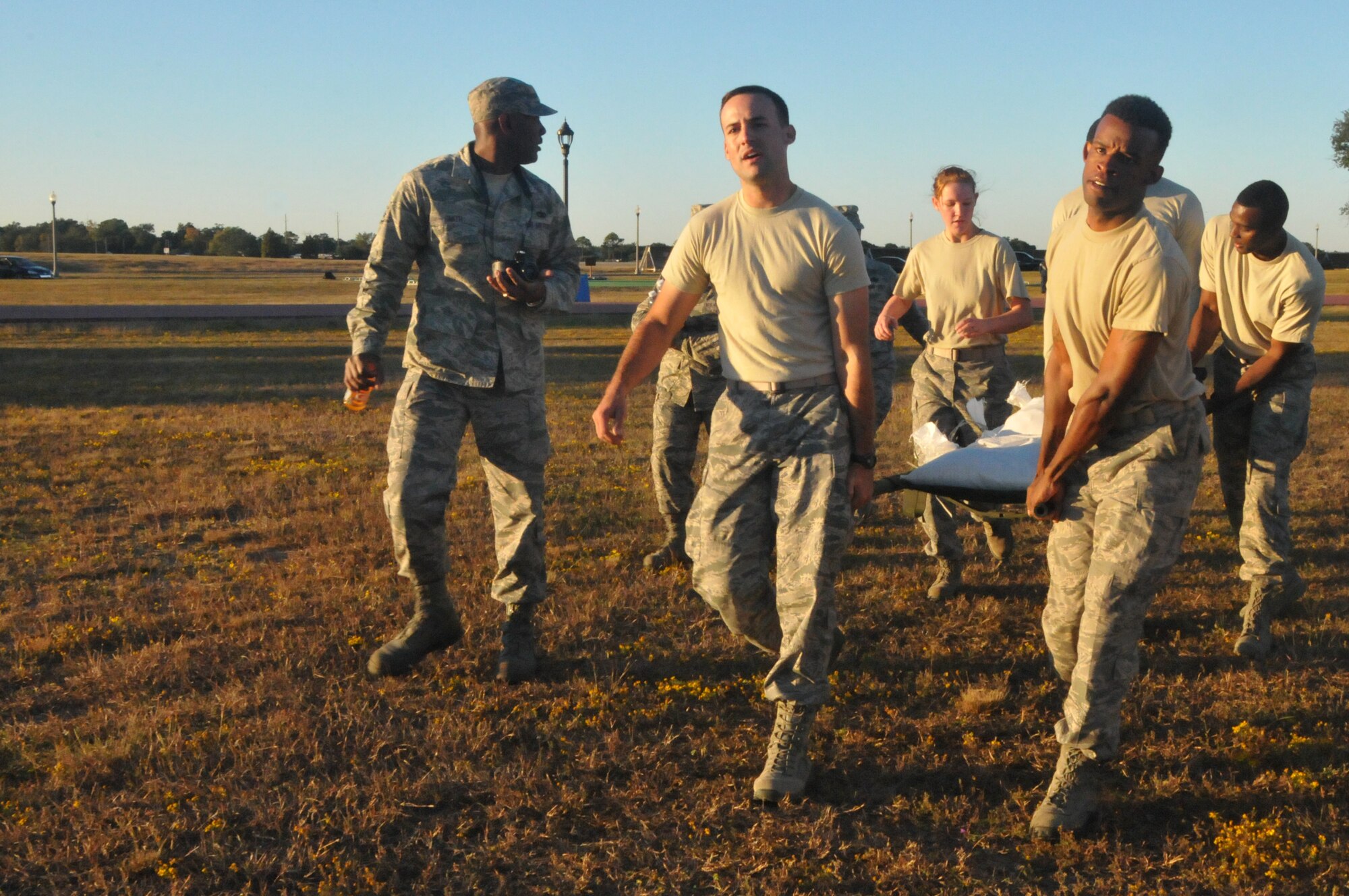 Members of the 403rd Wing take part in the Ultimate Warrior Challenge at the Triangle Track. The event was hosted by the Wing's Human Resource Development Council as a moral booster and team building event. (U.S. Air Force photo/Senior Airman Nicholas Monteleone)