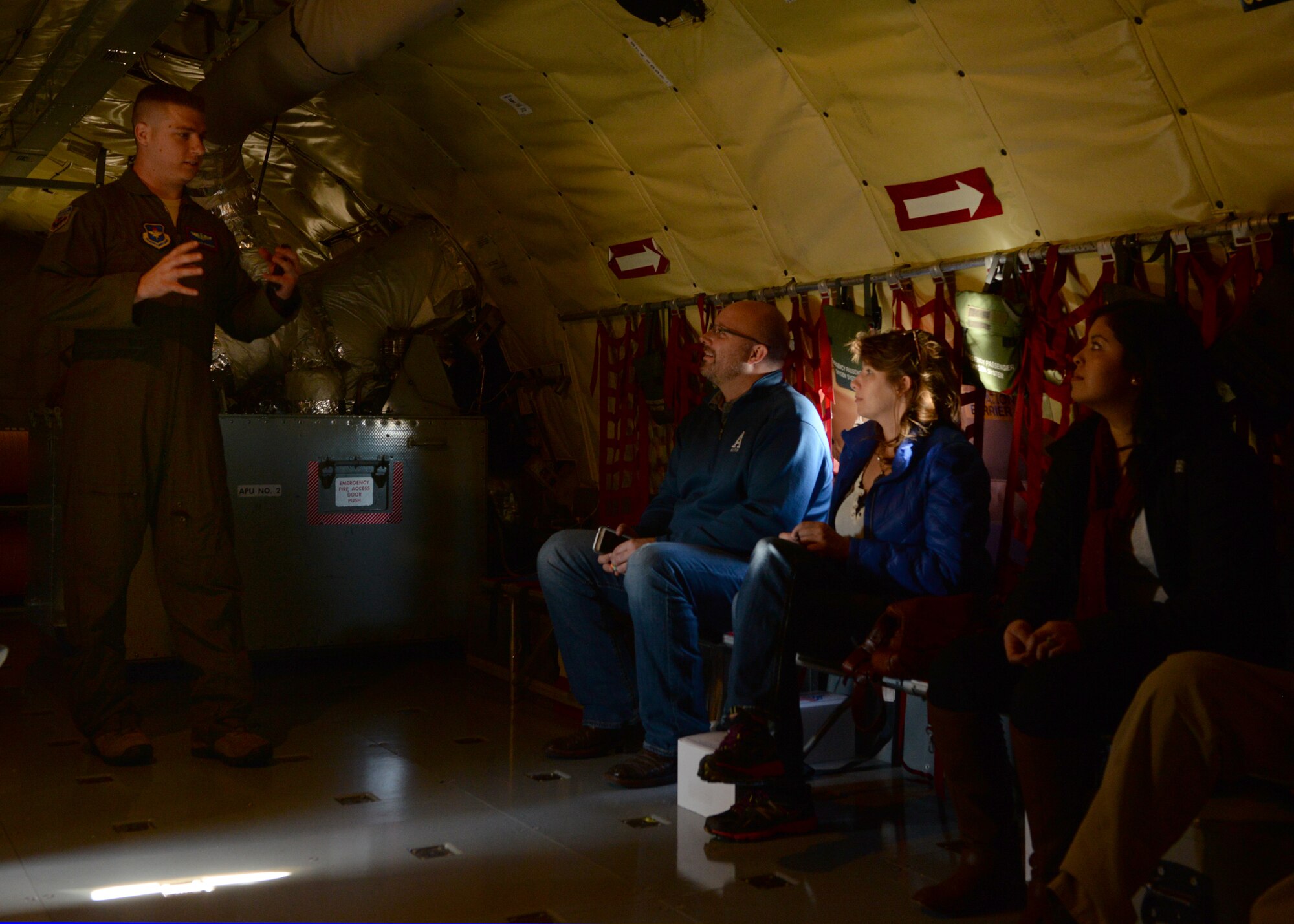 ALTUS AIR FORCE BASE, Okla. – U.S. Air Force Staff Sgt. Jacob Nenneman, 54th Air Refueling Squadron instructor boom operator, explains the process of in-flight refueling to U.S. Air Force KC-135 Stratotanker refueling aircraft passengers before a Farm City Week in-flight refueling demonstration, Nov. 7, 2014. Throughout the week approximately 100 people participated in demonstrations and learned about aspects of farming and (U.S. Air Force photo by Airman 1st Class Nathan Clark/Released)