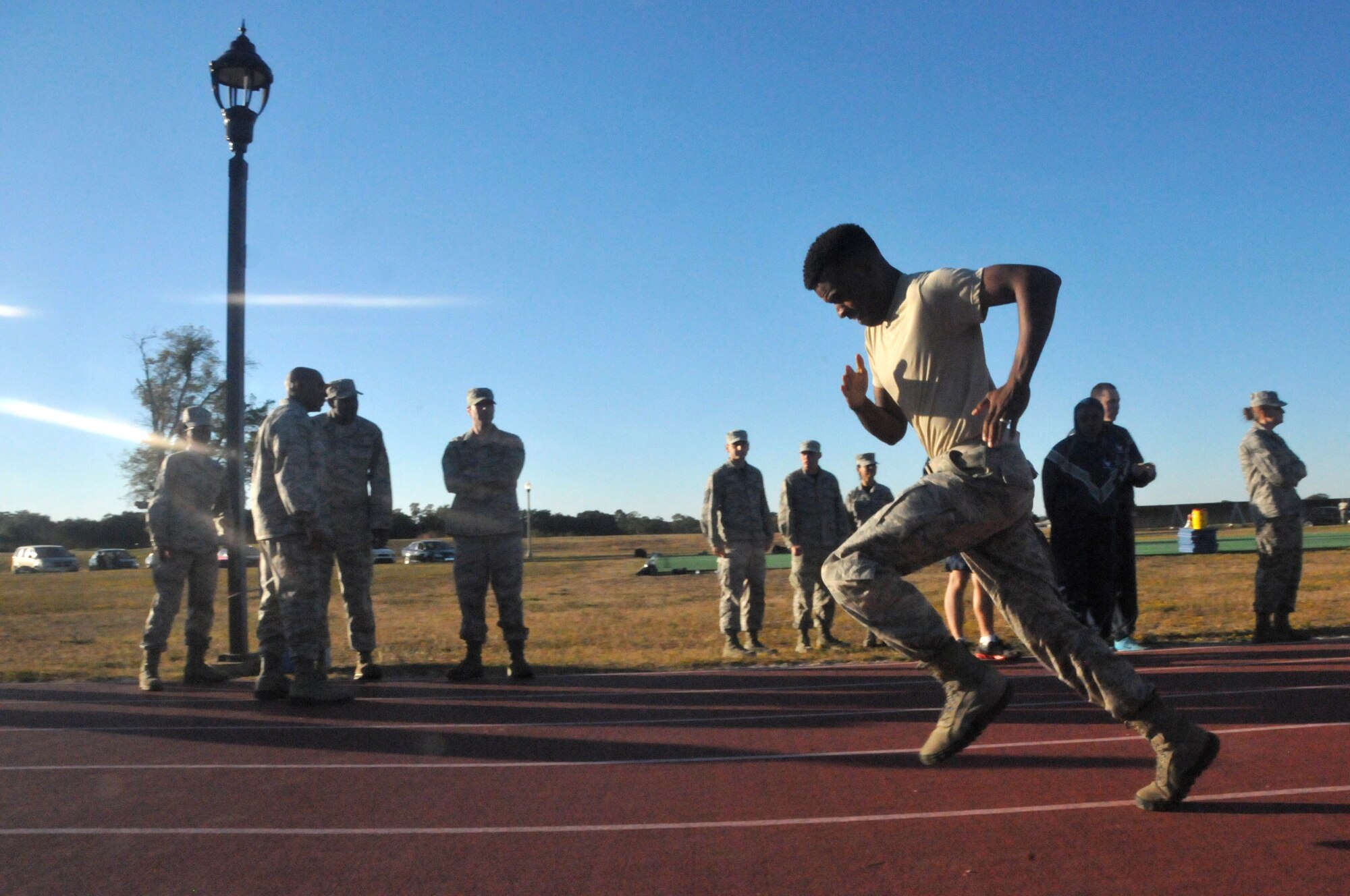 Members of the 403rd Wing take part in the Ultimate Warrior Challenge at the Triangle Track. The event was hosted by the Wing's Human Resource Development Council as a moral booster and team building event. (U.S. Air Force photo/Senior Airman Nicholas Monteleone)