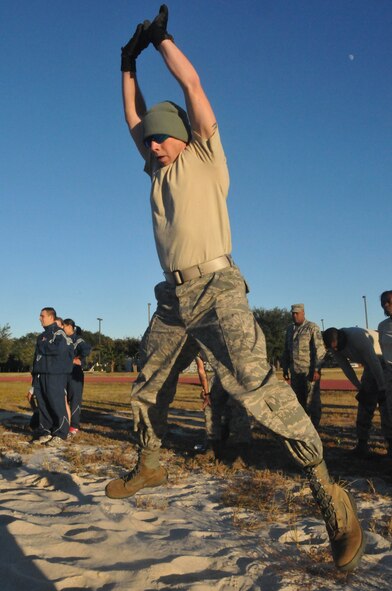 Members of the 403rd Wing take part in the Ultimate Warrior Challenge at the Triangle Track. The event was hosted by the Wing's Human Resource Development Council as a moral booster and team building event. (U.S. Air Force photo/Senior Airman Nicholas Monteleone)