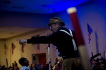 Retired Master Sgt. David Larrison, 91st Missile Wing mascot Teddy, chants during the Global Strike Challenge trophy take-back event on Barksdale Air Force Base, La., Nov. 3, 2014. Participants in the 2014 Global Strike Challenge included Air Force Global Strike Command's six wings plus units from Air Combat Command, Air Force Reserve Command and the Air National Guard. (U.S. Air force photo/Senior Airman Brittany Y. Bateman)