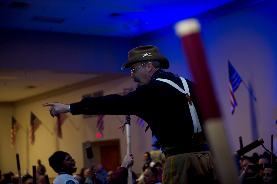 Retired Master Sgt. David Larrison, 91st Missile Wing mascot Teddy, chants during the Global Strike Challenge trophy take-back event on Barksdale Air Force Base, La., Nov. 3, 2014. Participants in the 2014 Global Strike Challenge included Air Force Global Strike Command's six wings plus units from Air Combat Command, Air Force Reserve Command and the Air National Guard. (U.S. Air force photo/Senior Airman Brittany Y. Bateman)