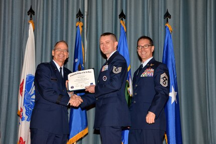 U.S. Air Force members at Joint Base San Antonio receive their Community College of the Air Force degrees Nov. 7, at a ceremony in the Fleenor Auditorium at Joint Base San Antonio-Randolph.  CCAF is federally-chartered degree-granting institution that serves the United States Air Force’s enlisted total force.  (U.S. Air Force photo/Desiree Palacios)