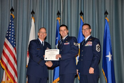 U.S. Air Force members at Joint Base San Antonio receive their Community College of the Air Force degrees Nov. 7, at a ceremony in the Fleenor Auditorium at Joint Base San Antonio-Randolph.  CCAF is federally-chartered degree-granting institution that serves the United States Air Force’s enlisted total force.  (U.S. Air Force photo/Desiree Palacios)