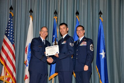 U.S. Air Force members at Joint Base San Antonio receive their Community College of the Air Force degrees Nov. 7, at a ceremony in the Fleenor Auditorium at Joint Base San Antonio-Randolph.  CCAF is federally-chartered degree-granting institution that serves the United States Air Force’s enlisted total force.  (U.S. Air Force photo/Desiree Palacios)