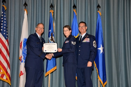 U.S. Air Force members at Joint Base San Antonio receive their Community College of the Air Force degrees Nov. 7, at a ceremony in the Fleenor Auditorium at Joint Base San Antonio-Randolph.  CCAF is federally-chartered degree-granting institution that serves the United States Air Force’s enlisted total force.  (U.S. Air Force photo/Desiree Palacios)