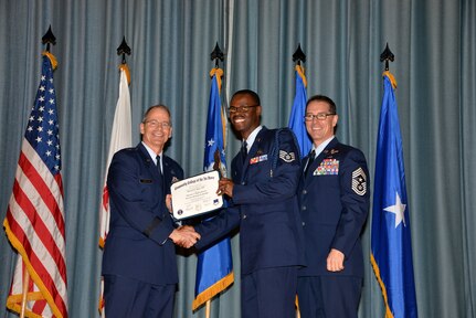 U.S. Air Force members at Joint Base San Antonio receive their Community College of the Air Force degrees Nov. 7, at a ceremony in the Fleenor Auditorium at Joint Base San Antonio-Randolph.  CCAF is federally-chartered degree-granting institution that serves the United States Air Force’s enlisted total force.  (U.S. Air Force photo/Desiree Palacios)