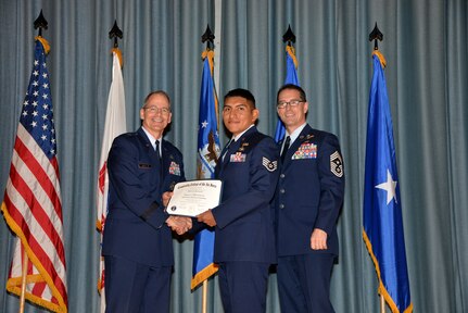 U.S. Air Force members at Joint Base San Antonio receive their Community College of the Air Force degrees Nov. 7, at a ceremony in the Fleenor Auditorium at Joint Base San Antonio-Randolph.  CCAF is federally-chartered degree-granting institution that serves the United States Air Force’s enlisted total force.  (U.S. Air Force photo/Desiree Palacios)