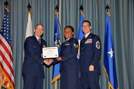 U.S. Air Force members at Joint Base San Antonio receive their Community College of the Air Force degrees Nov. 7, at a ceremony in the Fleenor Auditorium at Joint Base San Antonio-Randolph.  CCAF is federally-chartered degree-granting institution that serves the United States Air Force’s enlisted total force.  (U.S. Air Force photo/Desiree Palacios)