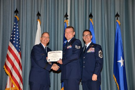 U.S. Air Force members at Joint Base San Antonio receive their Community College of the Air Force degrees Nov. 7, at a ceremony in the Fleenor Auditorium at Joint Base San Antonio-Randolph.  CCAF is federally-chartered degree-granting institution that serves the United States Air Force’s enlisted total force.  (U.S. Air Force photo/Desiree Palacios)