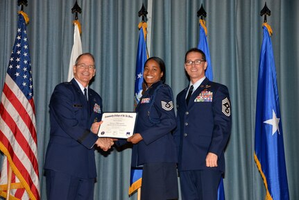 U.S. Air Force members at Joint Base San Antonio receive their Community College of the Air Force degrees Nov. 7, at a ceremony in the Fleenor Auditorium at Joint Base San Antonio-Randolph.  CCAF is federally-chartered degree-granting institution that serves the United States Air Force’s enlisted total force.  (U.S. Air Force photo/Desiree Palacios)