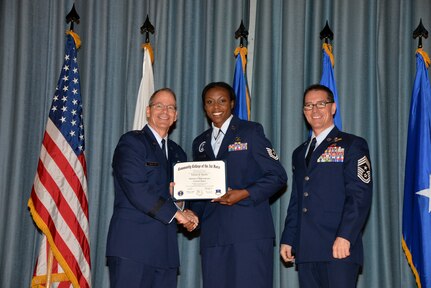 U.S. Air Force members at Joint Base San Antonio receive their Community College of the Air Force degrees Nov. 7, at a ceremony in the Fleenor Auditorium at Joint Base San Antonio-Randolph.  CCAF is federally-chartered degree-granting institution that serves the United States Air Force’s enlisted total force.  (U.S. Air Force photo/Desiree Palacios)