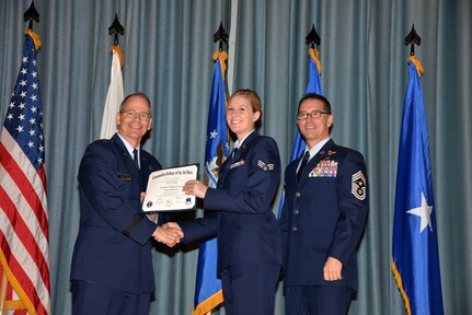 U.S. Air Force members at Joint Base San Antonio receive their Community College of the Air Force degrees Nov. 7, at a ceremony in the Fleenor Auditorium at Joint Base San Antonio-Randolph.  CCAF is federally-chartered degree-granting institution that serves the United States Air Force’s enlisted total force.  (U.S. Air Force photo/Desiree Palacios)