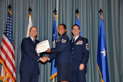 U.S. Air Force members at Joint Base San Antonio receive their Community College of the Air Force degrees Nov. 7, at a ceremony in the Fleenor Auditorium at Joint Base San Antonio-Randolph.  CCAF is federally-chartered degree-granting institution that serves the United States Air Force’s enlisted total force.  (U.S. Air Force photo/Desiree Palacios)