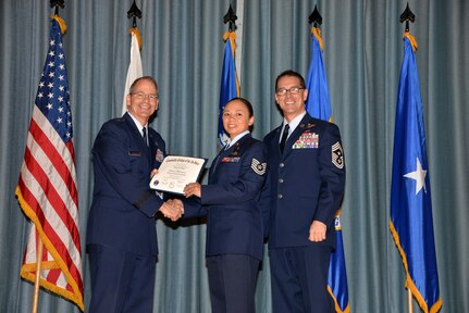 U.S. Air Force members at Joint Base San Antonio receive their Community College of the Air Force degrees Nov. 7, at a ceremony in the Fleenor Auditorium at Joint Base San Antonio-Randolph.  CCAF is federally-chartered degree-granting institution that serves the United States Air Force’s enlisted total force.  (U.S. Air Force photo/Desiree Palacios)
