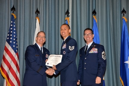 U.S. Air Force members at Joint Base San Antonio receive their Community College of the Air Force degrees Nov. 7, at a ceremony in the Fleenor Auditorium at Joint Base San Antonio-Randolph.  CCAF is federally-chartered degree-granting institution that serves the United States Air Force’s enlisted total force.  (U.S. Air Force photo/Desiree Palacios)