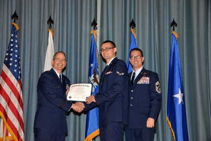 U.S. Air Force members at Joint Base San Antonio receive their Community College of the Air Force degrees Nov. 7, at a ceremony in the Fleenor Auditorium at Joint Base San Antonio-Randolph.  CCAF is federally-chartered degree-granting institution that serves the United States Air Force’s enlisted total force.  (U.S. Air Force photo/Desiree Palacios)