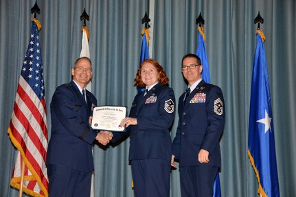 U.S. Air Force members at Joint Base San Antonio receive their Community College of the Air Force degrees Nov. 7, at a ceremony in the Fleenor Auditorium at Joint Base San Antonio-Randolph.  CCAF is federally-chartered degree-granting institution that serves the United States Air Force’s enlisted total force.  (U.S. Air Force photo/Desiree Palacios)