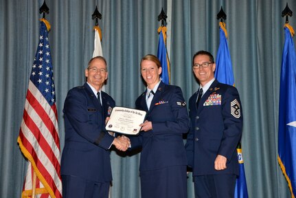 U.S. Air Force members at Joint Base San Antonio receive their Community College of the Air Force degrees Nov. 7, at a ceremony in the Fleenor Auditorium at Joint Base San Antonio-Randolph.  CCAF is federally-chartered degree-granting institution that serves the United States Air Force’s enlisted total force.  (U.S. Air Force photo/Desiree Palacios)