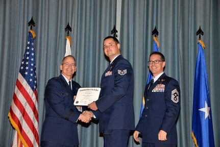 U.S. Air Force members at Joint Base San Antonio receive their Community College of the Air Force degrees Nov. 7, at a ceremony in the Fleenor Auditorium at Joint Base San Antonio-Randolph.  CCAF is federally-chartered degree-granting institution that serves the United States Air Force’s enlisted total force.  (U.S. Air Force photo/Desiree Palacios)
