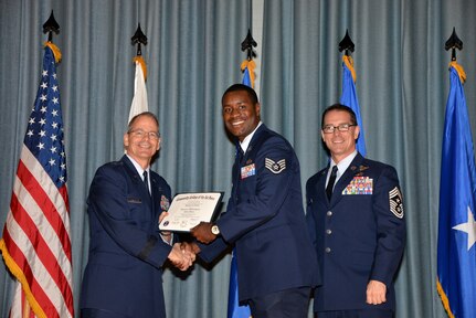 U.S. Air Force members at Joint Base San Antonio receive their Community College of the Air Force degrees Nov. 7, at a ceremony in the Fleenor Auditorium at Joint Base San Antonio-Randolph.  CCAF is federally-chartered degree-granting institution that serves the United States Air Force’s enlisted total force.  (U.S. Air Force photo/Desiree Palacios)