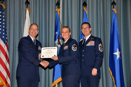 U.S. Air Force members at Joint Base San Antonio receive their Community College of the Air Force degrees Nov. 7, at a ceremony in the Fleenor Auditorium at Joint Base San Antonio-Randolph.  CCAF is federally-chartered degree-granting institution that serves the United States Air Force’s enlisted total force.  (U.S. Air Force photo/Desiree Palacios)