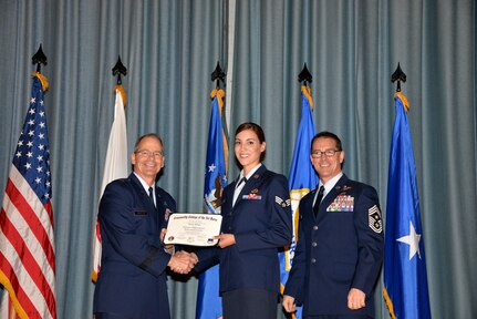 U.S. Air Force members at Joint Base San Antonio receive their Community College of the Air Force degrees Nov. 7, at a ceremony in the Fleenor Auditorium at Joint Base San Antonio-Randolph.  CCAF is federally-chartered degree-granting institution that serves the United States Air Force’s enlisted total force.  (U.S. Air Force photo/Desiree Palacios)