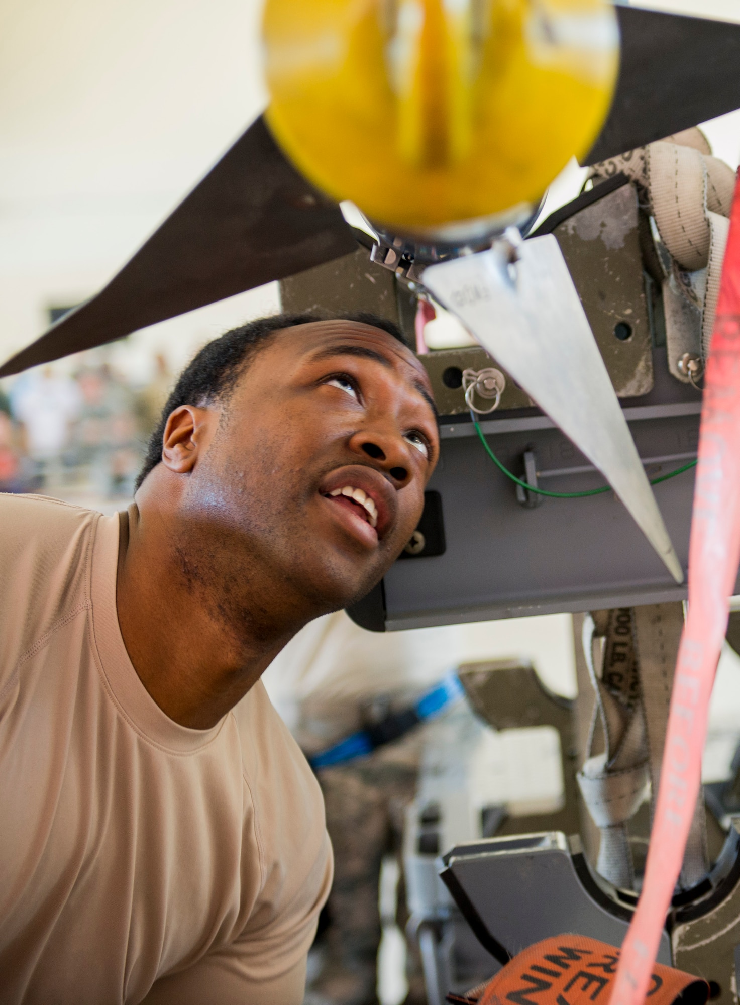 U.S. Air Force Senior Airman Rashad Holmes, 74th Aircraft Maintenance Unit load crew member, inspects an AIM-9 Sidewinder missile during a quarterly weapons load competition Nov. 7, 2014, at Moody Air Force Base, Ga. The 74th AMU won the competition for the second quarter in a row. (U.S. Air Force photo by Airman 1st Class Dillian Bamman/Released)