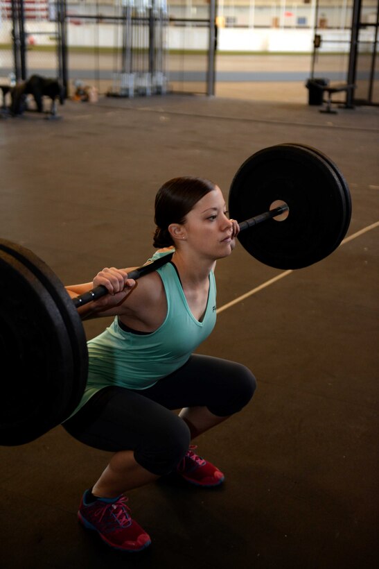 Senior Airman Samantha Rule, 28th Mission Support Group administrator, performs a circuit-training workout at the Pride Hangar at Ellsworth Air Force Base, S.D., Nov. 4, 2014. Rule has been participating in circuit training since July as a way to increase her physical fitness. (U.S. Air Force photo by Airman 1st Class Rebecca Imwalle/ Released)