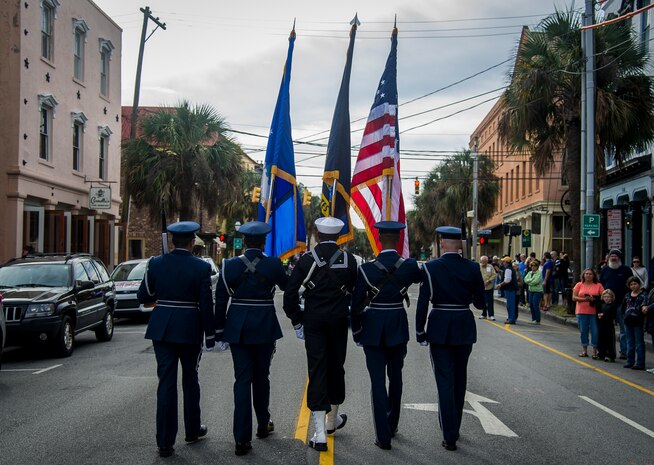 Members of the Joint Base Charleston Honor Guard lead the Ralph H. Johnson Veterans Hospital Annual Veterans Day parade Nov. 8, 2014, in Charleston, S.C. The origins of the holiday date back to President Woodrow Wilson who proclaimed Armistice Day to mark the end of World War I. The armistice between Germany and the Allied nations that ended WWI was signed on that day and a ceasefire went into effect on the 11th hour of the 11th day of the 11th month in 1918. (U.S. Air Force photo/Airman 1st Class Clayton Cupit)