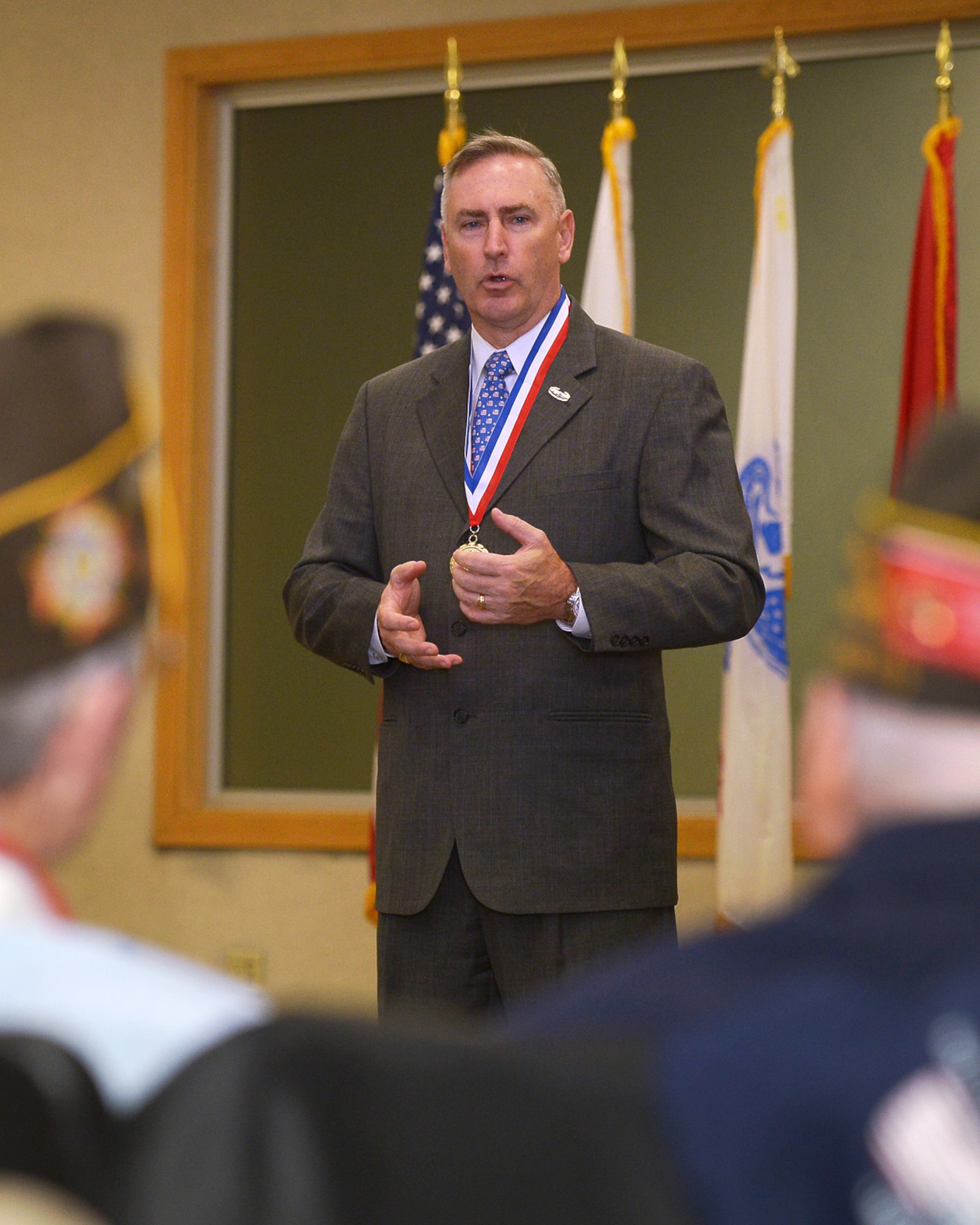 Retired U.S. Army Brig. Gen. Jack Hammond, executive director, Home Base Program, speaks during the Hanscom Salute to Veterans ceremony at the Hanscom Conference Center Nov. 7. The Home Base Program, a joint venture between the Boston Red Sox Foundation and Massachusetts General Hospital, provides care to veterans suffering from post-traumatic stress or traumatic brain injuries. (U.S. Air Force photos by Jerry Saslav)