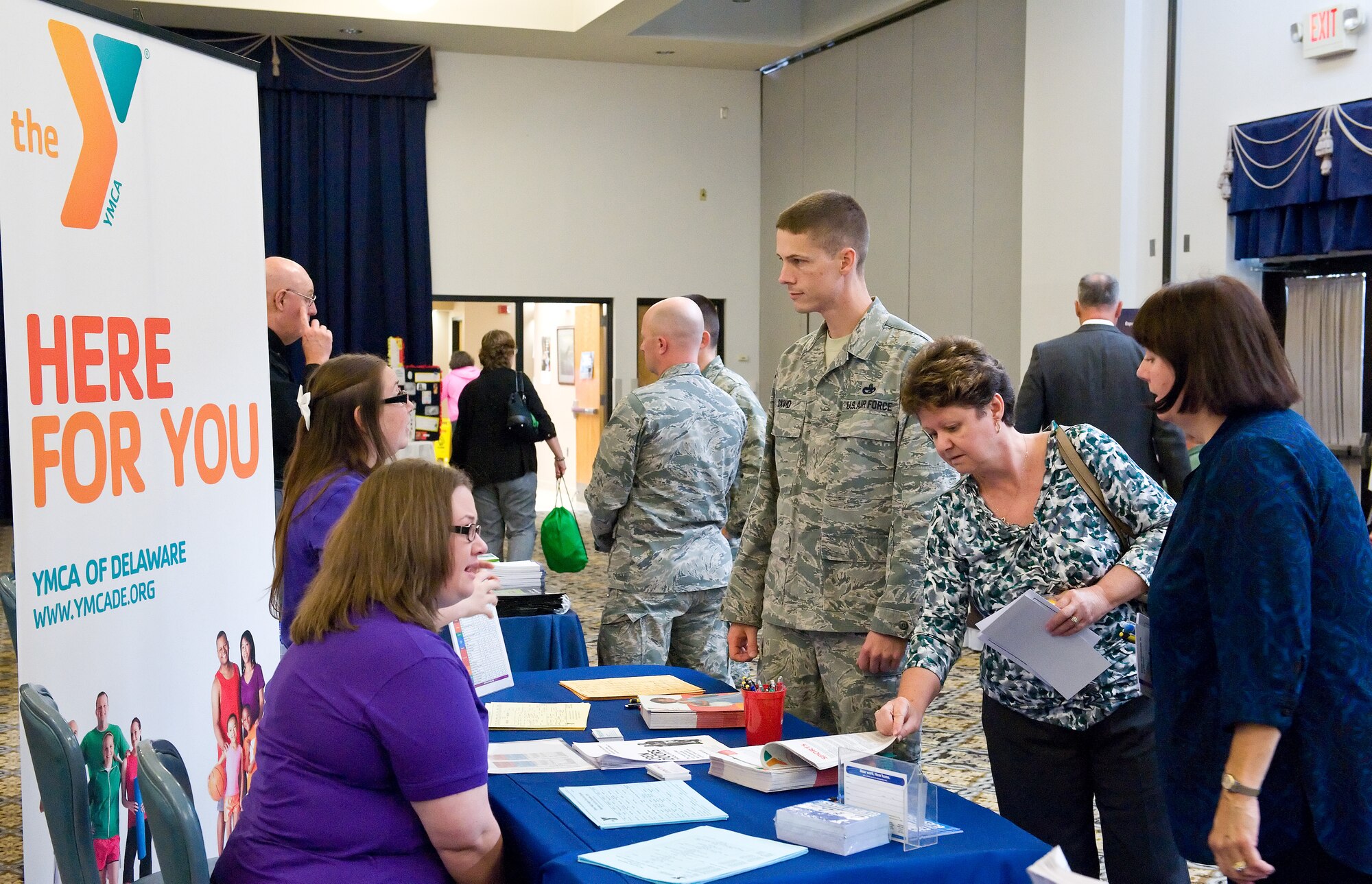 Team Dover members visit information booths during the Exceptional Family Member Program Information Fair Oct. 28, 2014, at The Landings on Dover Air Force Base, Del. The information fair and awareness luncheon was hosted by the National Disability Employment Awareness Month committee on Dover AFB. (U.S. Air Force photo/Roland Balik)