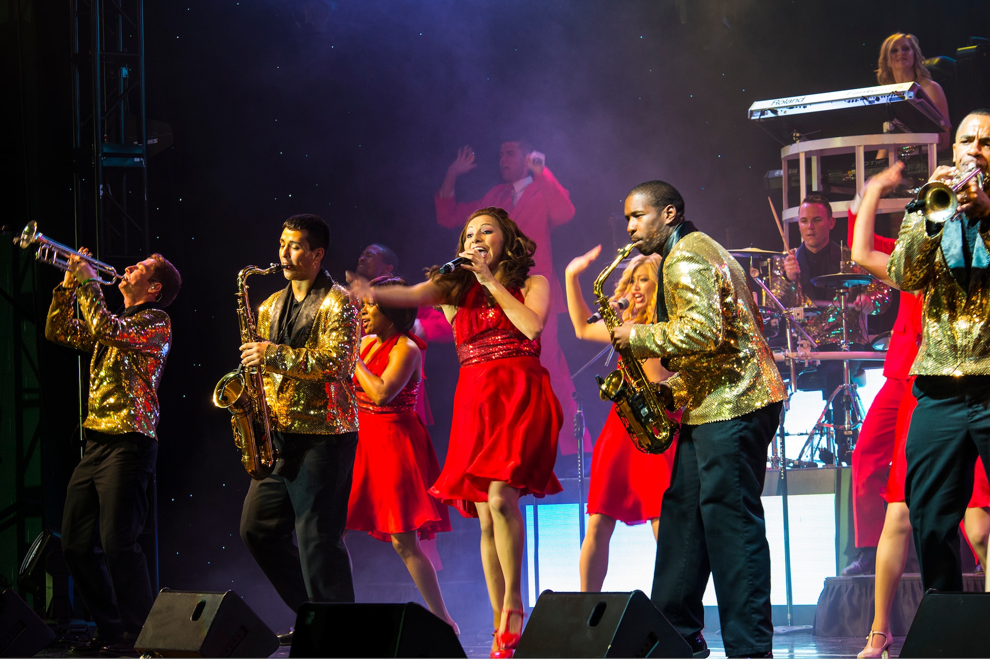 Members of Tops in Blue perform Nov. 6, 2014, at the Mathis Auditorium in Valdosta, Ga. Tops in Blue executed a variety of musical selection from different genres including country, rap, rock ‘n’ roll and R & B. (U.S. Air Force photo by Airman 1st Class Ceaira Tinsley)