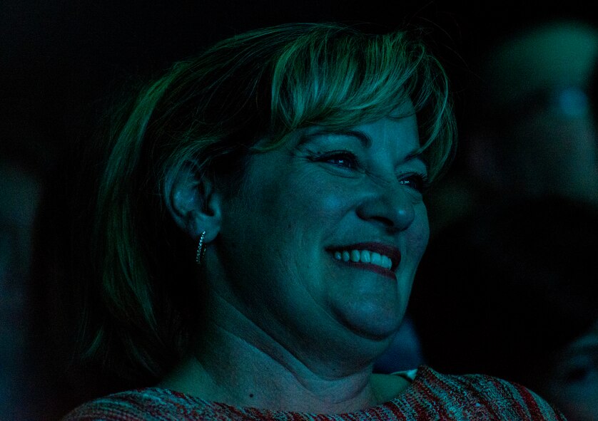 Diana Kelch, wife of Chief Master Sgt. David Kelch, 23d Wing Command Chief, smiles during Tops in Blue performance Nov. 6, 2014, at the Mathis Auditorium in Valdosta, Ga. Approximately 1,100 service members and civilians from the surrounding community attended the performance. (U.S. Air Force photo by Airman 1st Class Ceaira Tinsley)