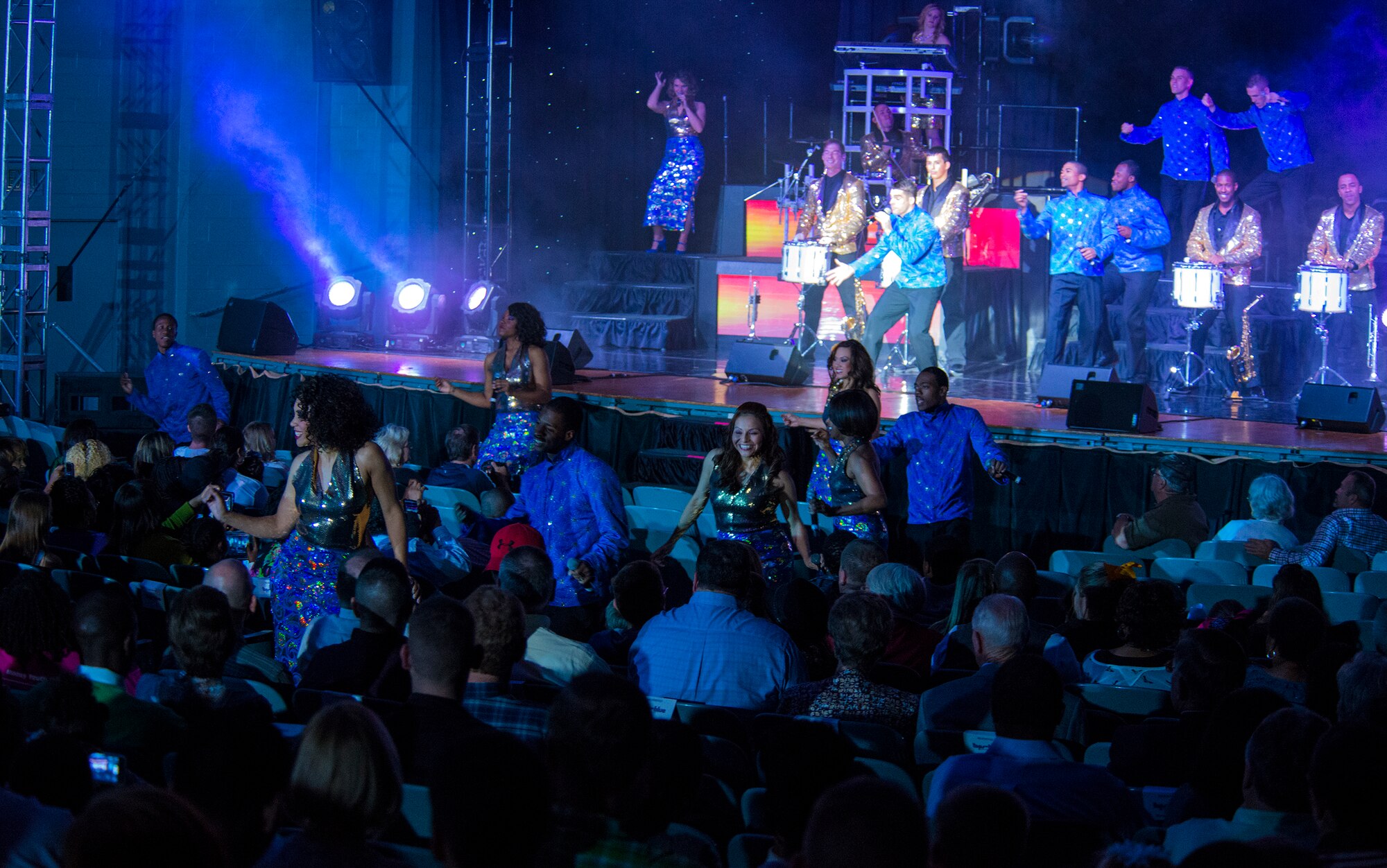 Members of Tops in Blue dance in the aisles during a performance Nov. 6, 2014, at the Mathis Auditorium in Valdosta, Ga. Tops in Blue kept the audience involved during the performance by bringing them on stage to be a part of the performance. (U.S. Air Force photo by Airman 1st Class Ceaira Tinsley)
