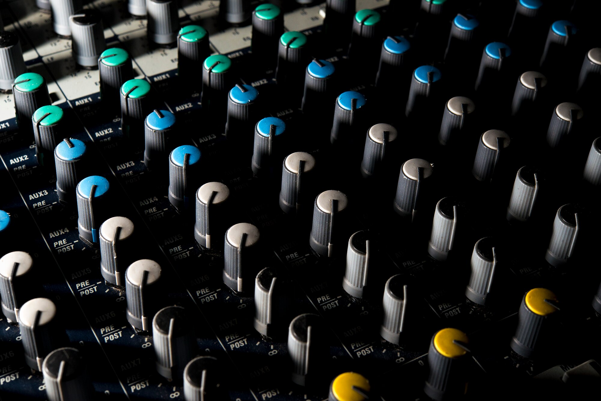 Light falls onto a soundboard during set up for a Tops In Blue show Nov. 5, 2014, at the Mathis City Auditorium in Valdosta, Ga. Tops In Blue is the Air Force’s premier entertainment showcase, featuring music, dance and comedy. (U.S. Air Force photo by Airman 1st Class Ryan Callaghan/Released)