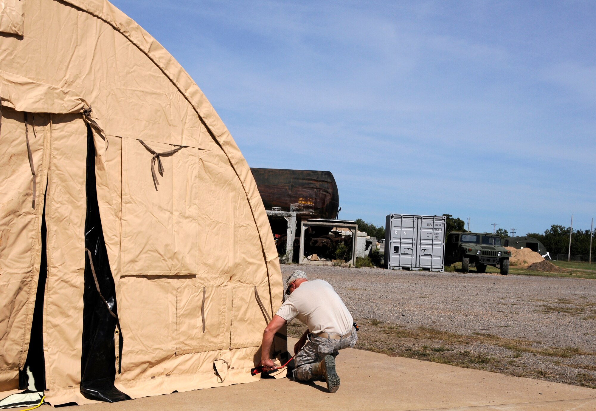 Members of the 188th Civil Engineering Squadron work to erect a tent during a bivouac training exercise at Ebbing Air National Guard Base, Fort Smith, Ark., Oct. 4, 2014. (U.S. Air National Guard photo by Staff Sgt. Hannah Landeros/released)