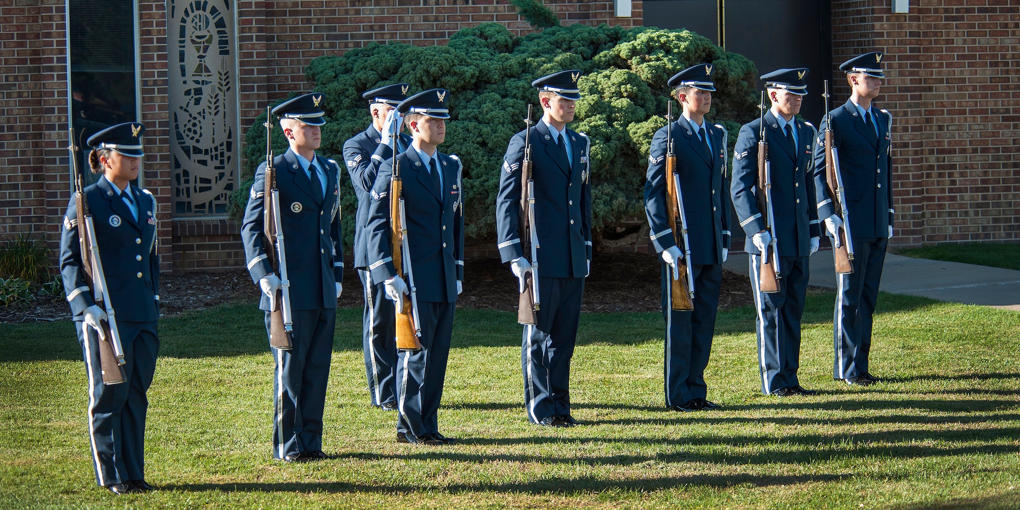 PETERSON AIR FORCE BASE, Colo. – The High Frontier Honor Guard stands in formation before firing their rifles during the POW/MIA Remembrance ceremony Sept. 18. The honor guard is an elite team of Airmen here who represent the Air Force by presenting colors, performing retirement ceremonies and providing final tribute for deceased military members, as well as other details. (U.S. Air Force photo/Craig Denton)