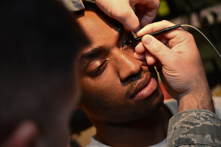 Master Sgt. Mark Slater, 28th Medical Operations Squadron NCO in charge of optometry, administers a corneal pachymetry test to Airman 1st Class Jordan Fishburn, 28th Logistics Readiness Squadron aircraft parts store technician, during a pre-operation procedure in the optometry clinic at Ellsworth Air Force Base, S.D., Oct. 24, 2014. As part of pre-operation procedures, the test measures the thickness of the cornea and allows surgeons to examine the layout of their patient’s eyes to identify defects. (U.S. Air Force photo by Senior Airman Zachary Hada/Released))