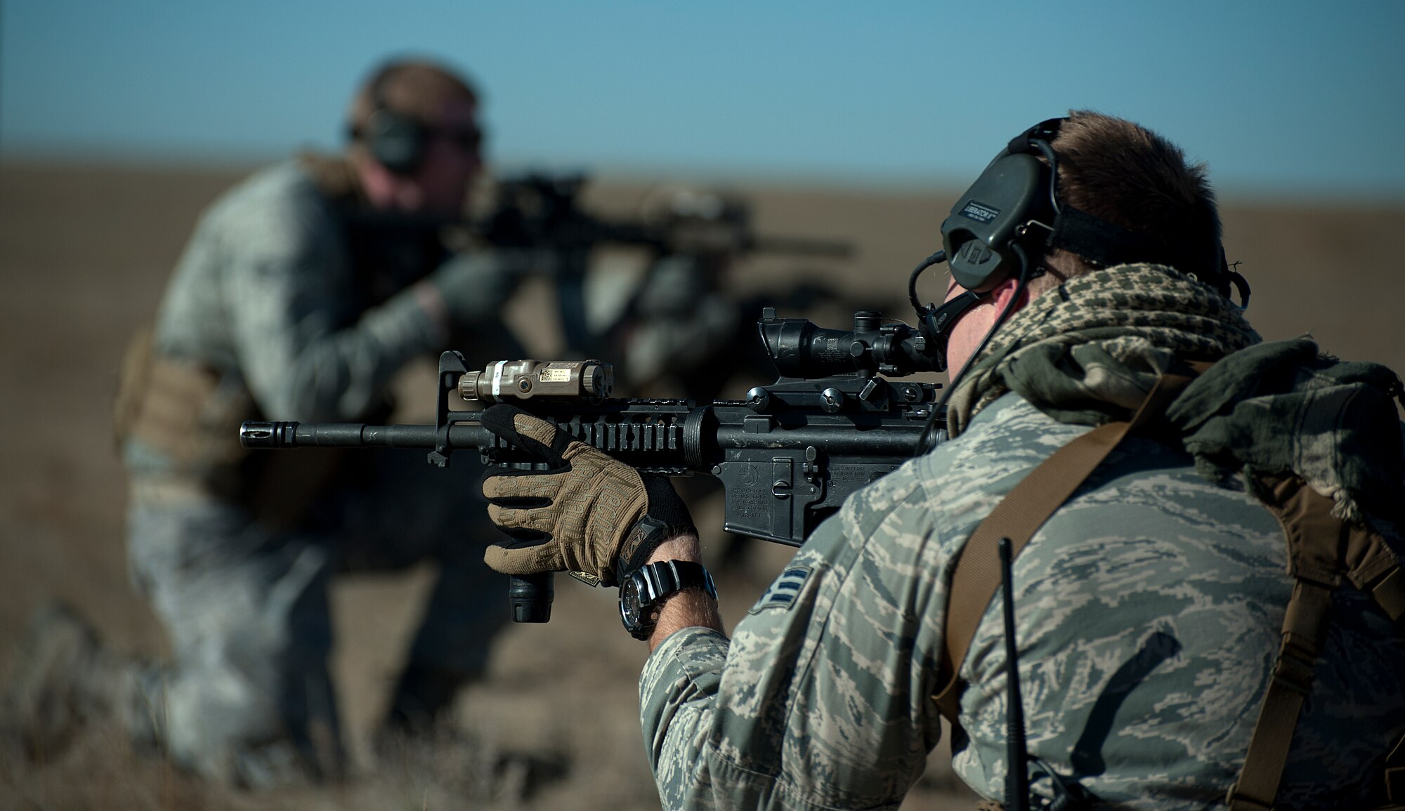 Senior Airman Nicholas Nolan, 90th Security Forces Group Tactical Response Force, provides rear cover as his team prepares to enter the launch facility A-06 during a training exercise Nov. 7, 2014. Security forces Airmen are trained to maintain a 360 degree cover when awaiting orders to move. (U.S. Air Force photo by Airman 1st Class Brandon Valle)
