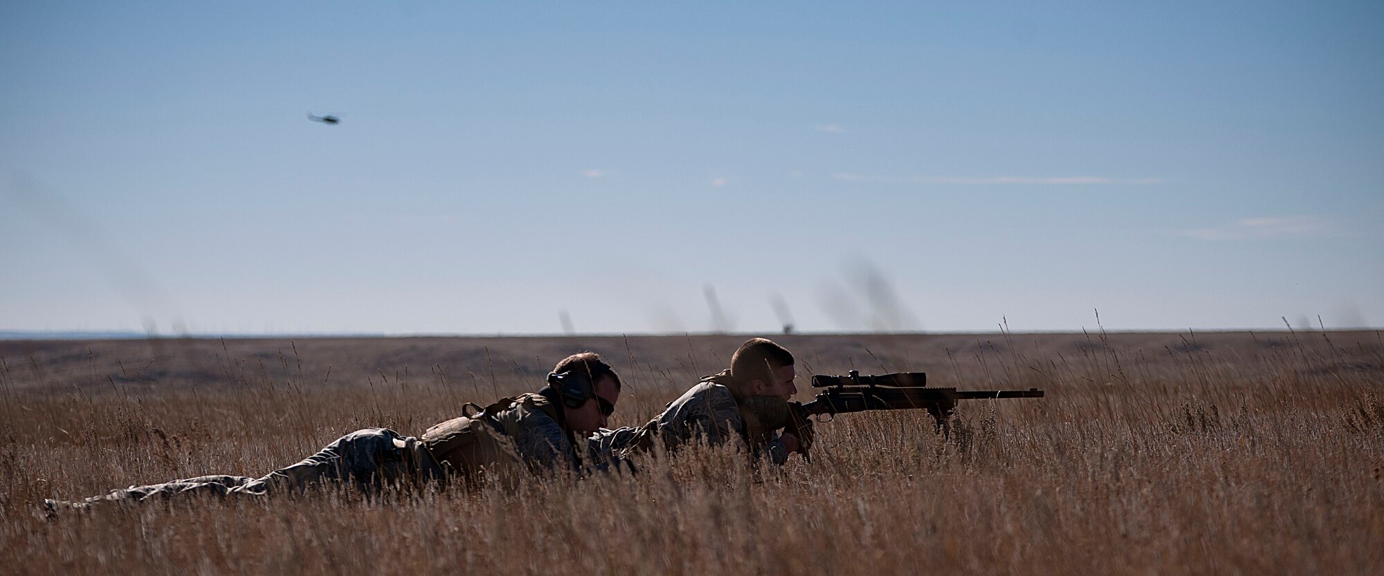 Senior Airman Evan Van Neiuwenhuyze, 90th Security Forces Squadron, provides cover sniper support for other defenders Nov. 7, 2014, during a training exercise to recapture the launch facility A-06. Staff Sgt. Dylan Kempker, 790th Missile Security Forces Squadron, acted as spotter for Van Neiuwenhuyze.  (U.S. Air Force photo by Airman 1st Class Brandon Valle)
