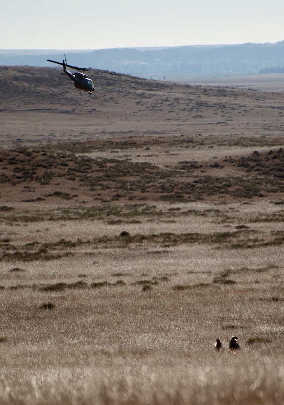 A UH-1N helicopter from the 37th Helicopter Squadron after tactically inserting Airmen from the 90th Security Forces Group Tactical Response Force Nov. 7, 2014, during a training exercise at launch facility A-06. The 37th HS works with the 90th SFG to provide air capabilities for the missile field. (U.S. Air Force photo by Airman 1st Class Brandon Valle)
