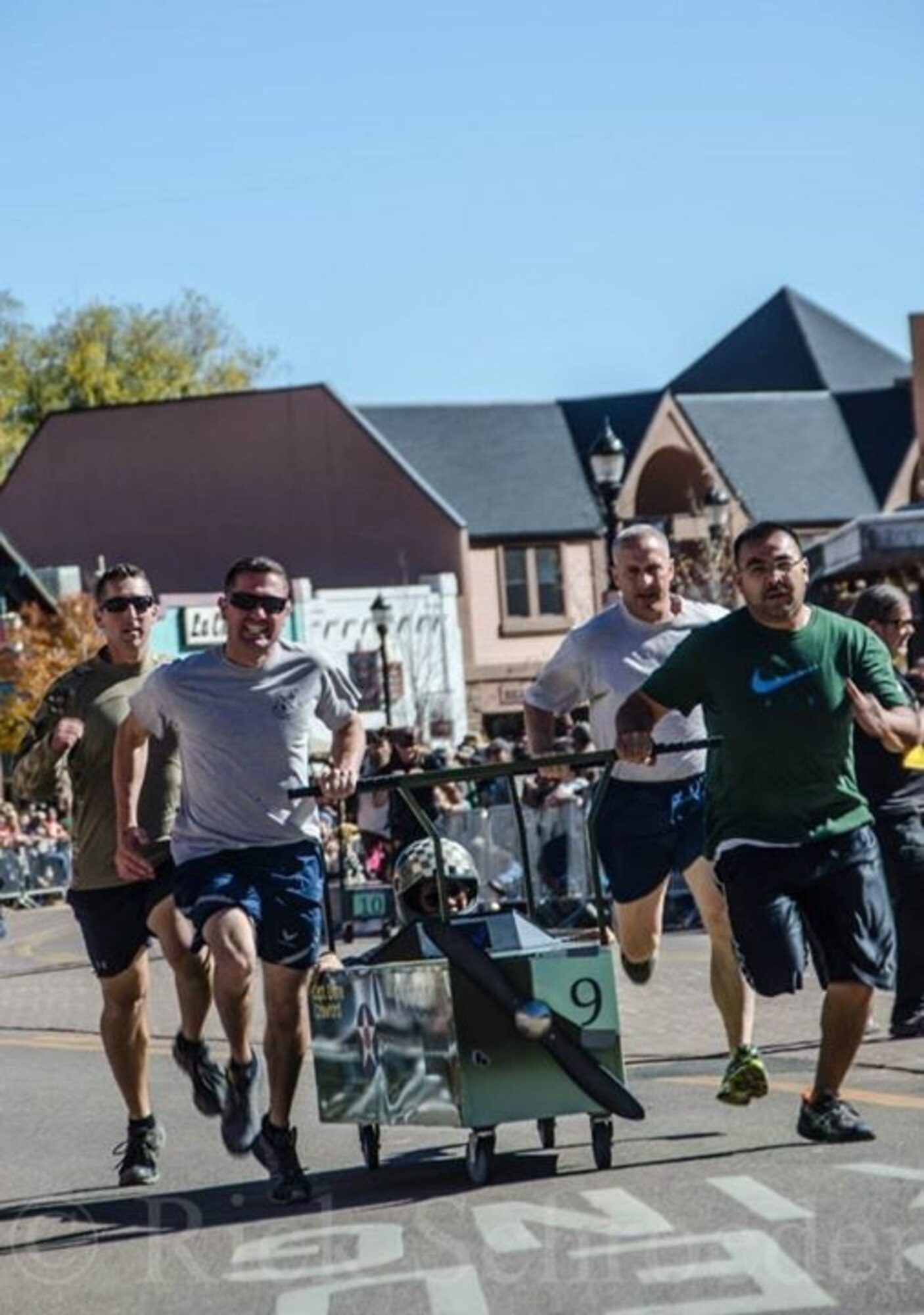 MANITOU SPRINGS, Colo. – A Peterson Air Force Base team races their way to victory in the 20th annual Emma Crawford Coffin Race Oct. 25 in Manitou Springs. The team, comprised of Airmen from the Vosler NCO Academy and their families, included Senior Master Sgt. Jon Baumeyer, Master Sgt. Jonathan Kiley, Tech. Sgt. Christine “Emma” Orona and her husband Javier Orona, and Tech. Sgt. Brett Lafreniere. This was the third consecutive year the Vosler NCOA fielded a team in the race, improving their finish time each year. The team muscled their coffin 200 yards to the finish line with a winning time of 24.66 seconds. The 100-pound, aircraft-inspired coffin took more than 100 hours to weld and construct. This year’s race drew 50 entries and more than 12,000 spectators. (Courtesy photo)