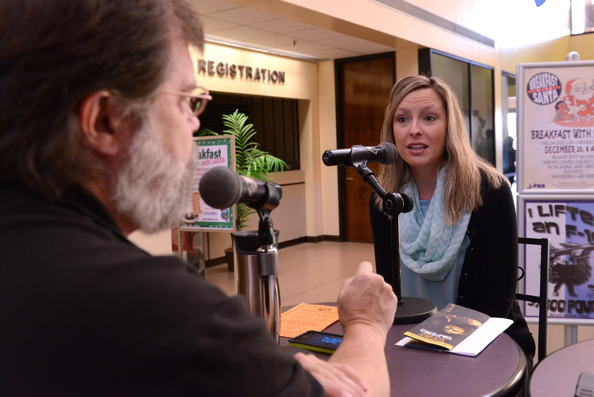 Penny Hardin, 20th Aerospace Medicine Squadron health promotion flight program coordinator, and Derek Burress, Good Morning Sumter radio show host, talk live on the radio at Shaw Air Force Base, S.C., Nov. 7, 2014. The radio show typically broadcasts from Shaw on the first and third Friday of the month from 7-9 a.m. (U.S. Air Force photo by Airman 1st Class Diana M. Cossaboom/Released)