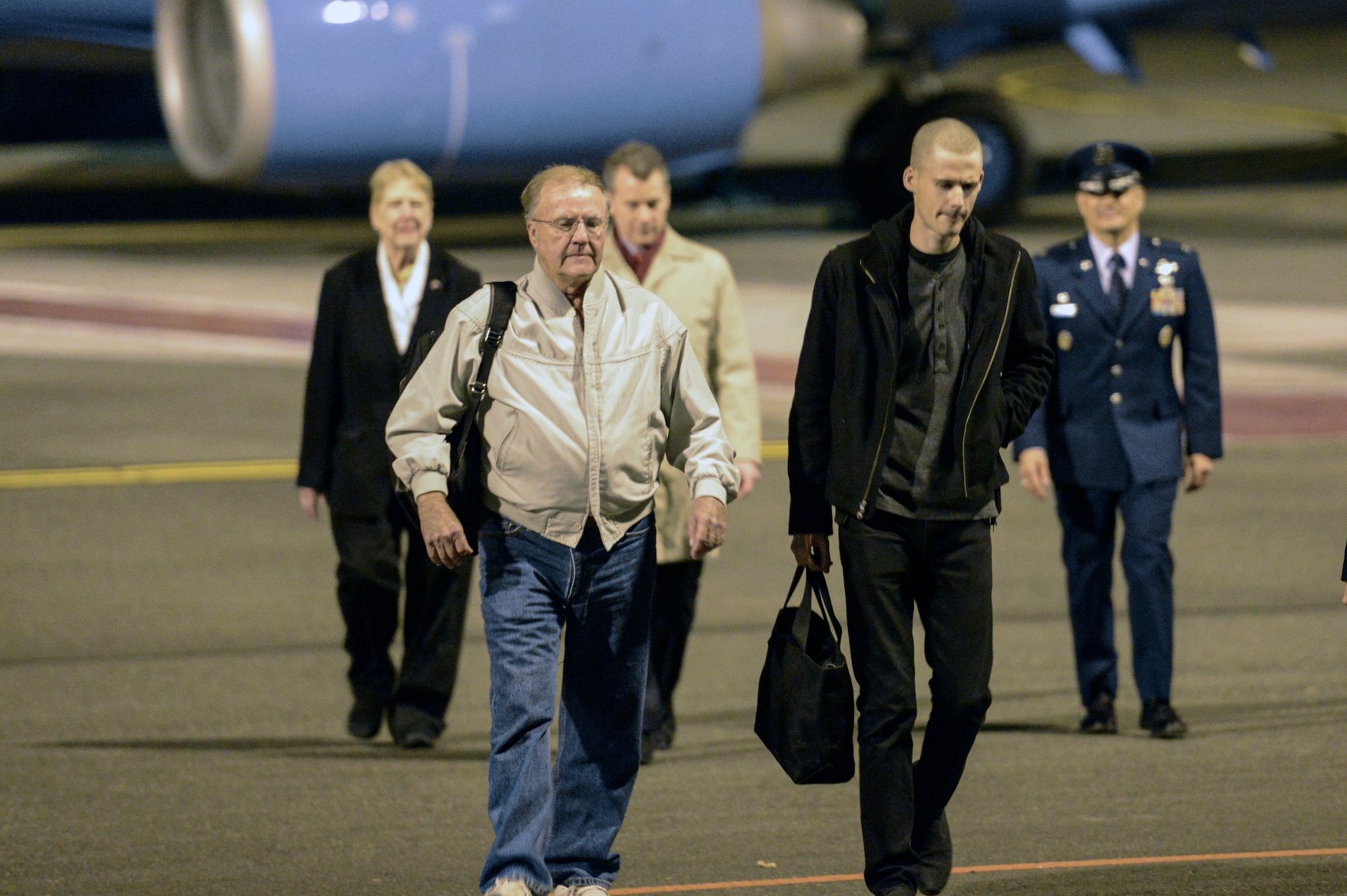 Mathew Miller (right), one of the last two American citizens imprisoned in North Korea, walks into the McChord Field Passenger Terminal Nov. 8th, 2014, at Joint Base Lewis-McChord, Wash., after spending more than seven months in a North Korean prison. Miller was sentenced to six years hard labor for espionage after allegedly ripping up his passport and seeking asylum upon his entry into North Korea. (U.S. Air Force photo/Staff Sgt. Russ Jackson)