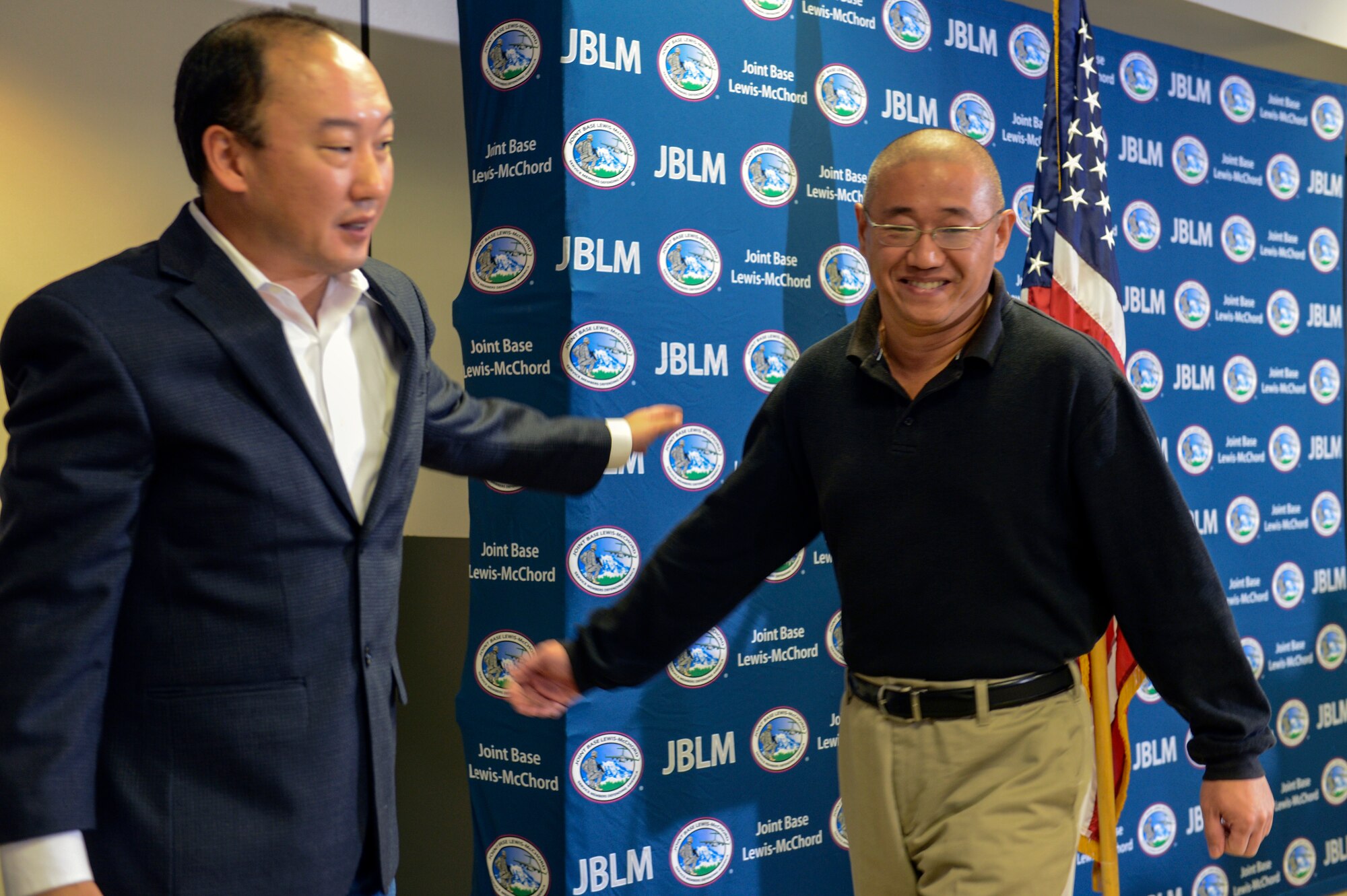 Kenneth Bae, one of the last two American citizens imprisoned in North Korea, smiles after speaking to the media Nov. 8th, 2014, at Joint Base Lewis-McChord, Wash., upon his return to the United States after spending more than two years in a North Korean prison. Bae was accused of plotting to bring down the North Korean government through religious activities late in 2012 and was sentenced to 15 years of hard labor. (U.S. Air Force photo/Staff Sgt. Russ Jackson)