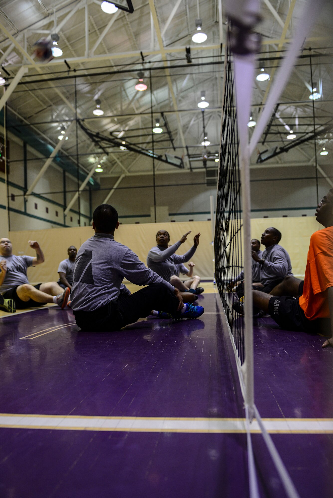 U.S. Army Soldiers of the Warrior Transition Unit participate in seated volleyball as part of Warrior Care Month at Fort Eustis, Va., Nov. 6, 2014. This year the Warrior Care month will focus on four areas, resiliency, recovery, reintegration and remaining Strong. (U.S. Air Force photo by Senior Airman Kimberly Nagle/Released) 